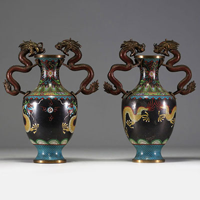 China - Pair of cloisonné vases, handles and body decorated with dragons.