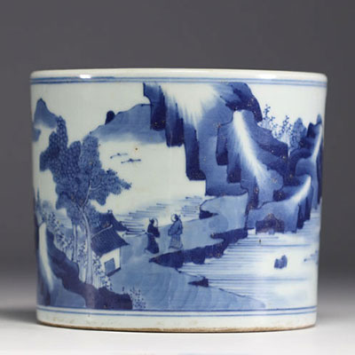 China - A white and blue porcelain brush with landscape decoration.
