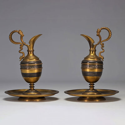 Pair of antique bronze pourers with silver inlay