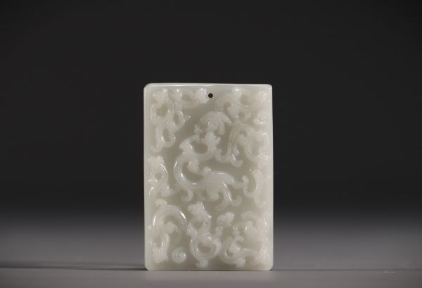 China - White jade pendant with chimera design.