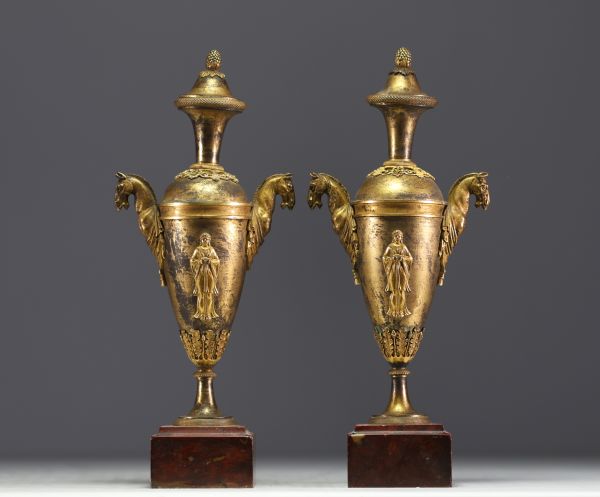 A pair of gilt bronze Directoire period covered vases.