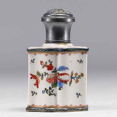 Samson porcelain tea caddy with floral design, topped with a silver stopper.