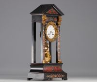 Clock in blackened wood and Boule marquetry from Napoleon III period, 19th century.