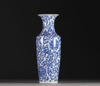 China - A white-blue porcelain baluster vase decorated with lotus flowers, double circle mark, Qing period.