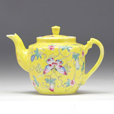 Famille Rose porcelain teapot decorated with flowers on a yellow background