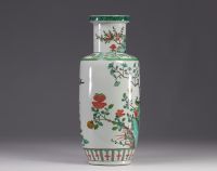 China - A green family porcelain vase decorated with trees and birds, early 20th century.