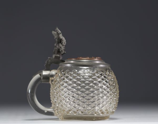 German diamond-point glass tankard with pewter lid featuring a figure.