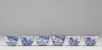 China - set of cloisonné trays and goblets with white-blue decoration of rural scenes and figures, Qing period.