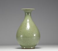 China - Monochrome porcelain vase with floral decoration in relief, 19th century.