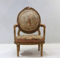 Important ensemble de mobilier de salon en bois sculpté et doré, tapisserie fine d'Aubusson comprenant un canapé et une suite de quatre fauteuils bergères, XIXème.