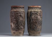 Japan - Pair of stoneware vases decorated with figures and animals, Meiji period.