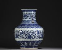 China - Large Hu-shaped vase in blue-white porcelain with floral decoration and bamboo handles, 19th century