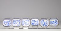 China - set of cloisonné trays and goblets with white-blue decoration of rural scenes and figures, Qing period.