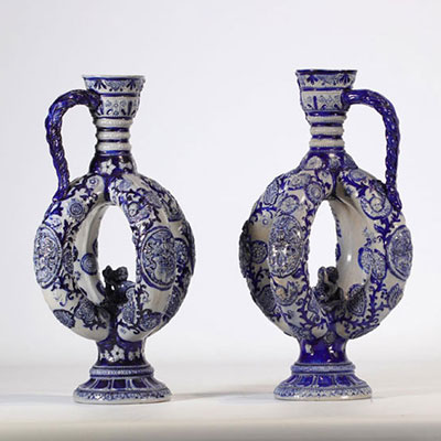 (2) Pair of stoneware jugs decorated with various designs in blue on white