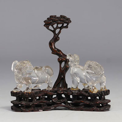 China - Rock crystal Fô dogs on finely carved wooden base, 19th century