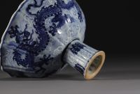 China - Bowl on foot in blue-white porcelain decorated with dragons in waves, Xuande mark.