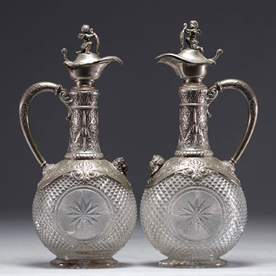 Pair of Baccarat crystal and silver wine decanters.