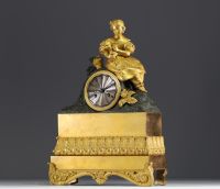 Gilt and patinated bronze clock decorated with Young Girl with Flower Basket, striking movement, Empire period.