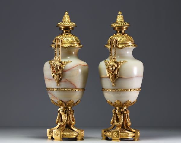 Imposing pair of Louis XVI chased gilt bronze and onyx cassolettes.