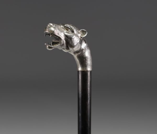 Art Deco silver cane with lioness head decoration and glass eyes.