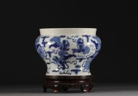 China - A blue-white porcelain vase decorated with lions, Kangxi mark.