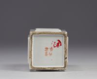 Brush pot decorated with figures and various objects on a white background.