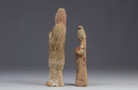 China - Two polychrome terracotta statues in the form of figures, from the Tang period (618-907).