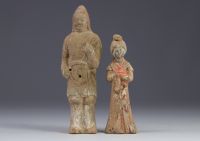 China - Two polychrome terracotta statues in the form of figures, from the Tang period (618-907).