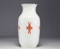 Meissen - Porcelain vase decorated with orange dragons on a white background.