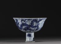 China - Bowl on foot in blue-white porcelain decorated with dragons in waves, Xuande mark.