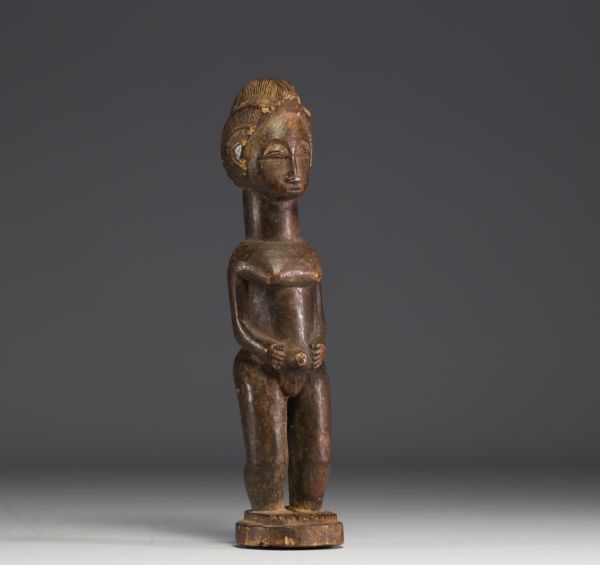 DRC - Iwena female statuette in carved wood.