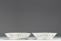 China - A pair of polychrome porcelain dishes decorated with birds, peonies and a calligraphic poem.