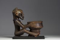 Africa DRC - Songye statue carrying a cup.