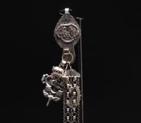 Magnificent large silver chatelaine decorated with various charms, Dutch hallmarks and others.