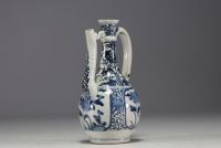 Japan - White and blue porcelain jug with floral decoration, 17th century.