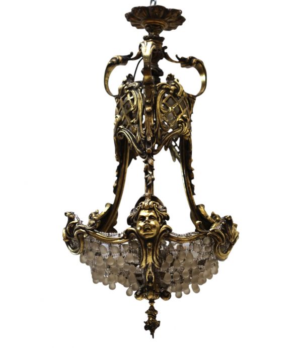 Hot-air balloon chandelier, bronze frame decorated with cherub faces, glass beads, 19th century.