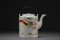 China - Porcelain teapot with dragon design, circa 1900.