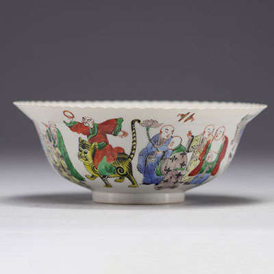 China - Porcelain bowl decorated with frieze of characters, mark in red under the piece.