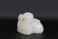 China - Small white jade pendant representing a cat, 18th century.