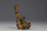 China, Tibet - Gilded bronze sculpture with stone inlays.