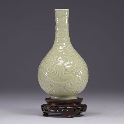 China - Monochrome bottle vase decorated with dragons in relief, Qing period.