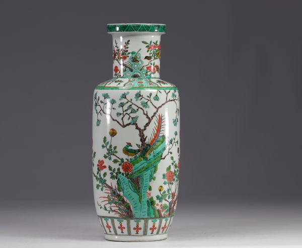 China - A green family porcelain vase decorated with trees and birds, early 20th century.