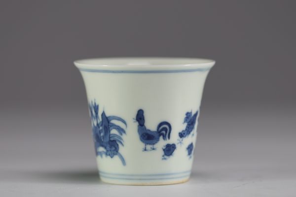 China - White-blue porcelain cup decorated with a rooster and hens.