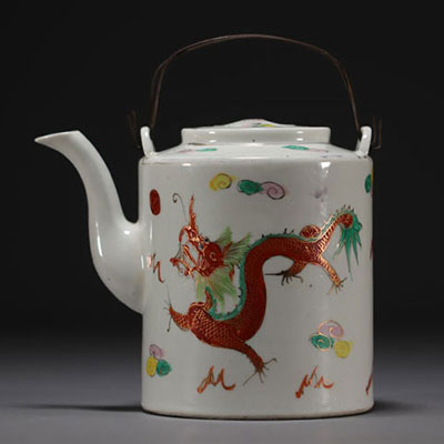 China - Porcelain teapot with dragon design, circa 1900.