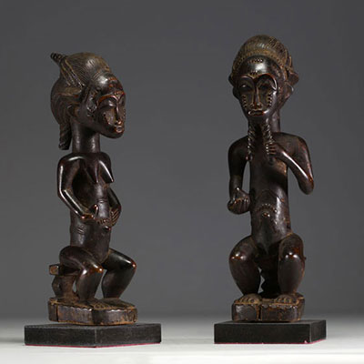 Africa - A pair of Baule wooden statues, 20th century.