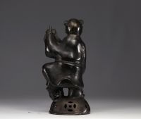 China - bronze sculpture of a young boy carrying a scroll.