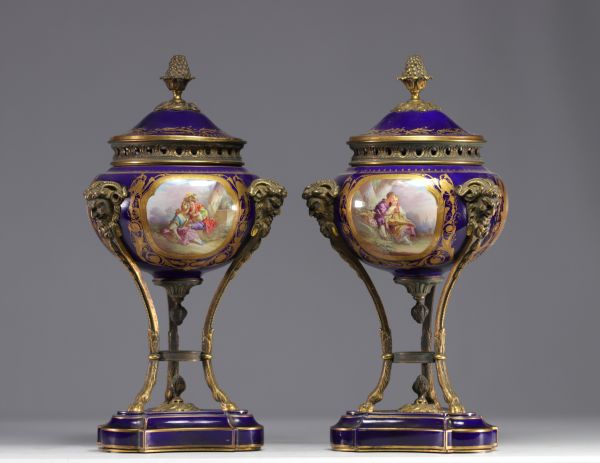 Pair of Sèvres porcelain cassolettes decorated with gallant scenes, mounted on bronze.