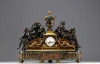 Imposing ormolu and patinated mantel clock decorated with antique figures, marble base, 19th century.