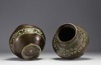 China - Pair of bronze vases decorated with Fô dogs, debossed mark under the pieces.