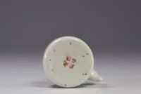 China - Famille rose porcelain teapot decorated with characters.